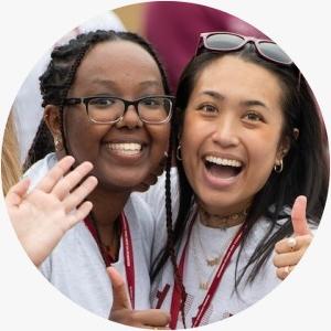 Two students have smiling faces on Welcome Back day